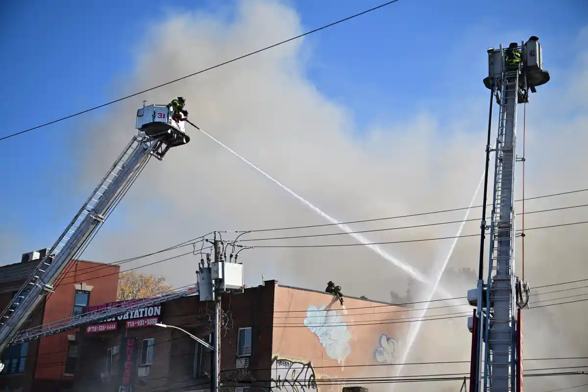 Five-alarm blaze engulfs Bronx apartment building, firefighters respond.